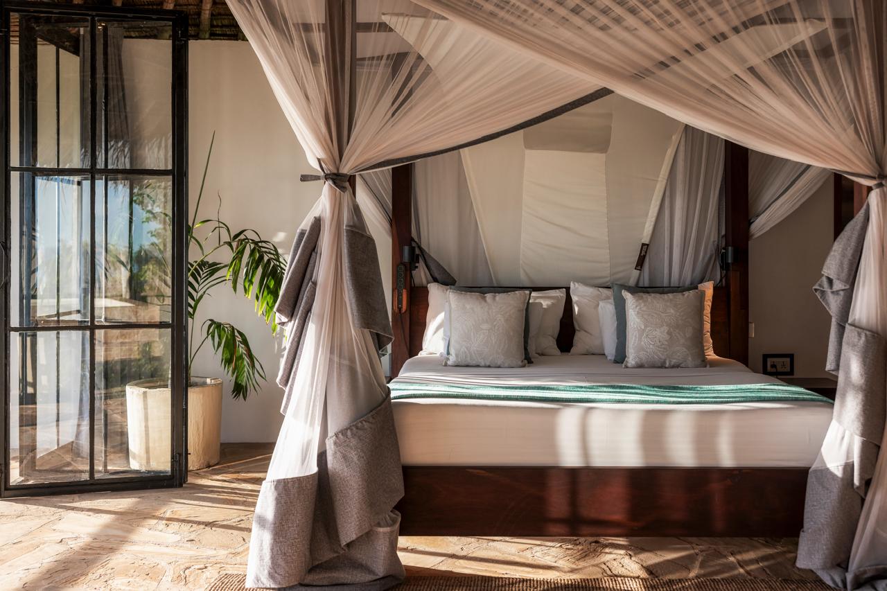 Luxury canopy bedroom with ocean views
