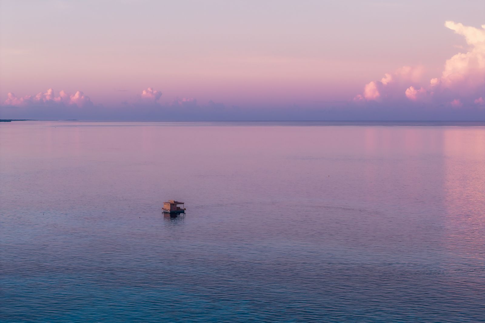 The Manta Resort floating room at pink dawn