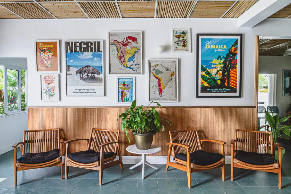 Mid-century lobby lounge at Skylark with vintage Jamaican travel posters